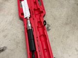 an image of a tool in a red case on the floor