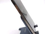 a close up of a cell phone on a stand