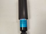 a close up of a black cylinder with a blue label on it