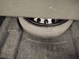 a close up of a tire on a car ' s rim