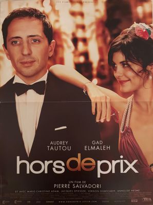 une affiche de cinéma représentant un homme et une femme en smoking
