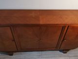 a wooden cabinet that is sitting on the floor