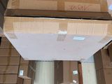 many boxes stacked on top of each other in a warehouse