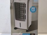 the box of a portable air conditioner sitting on a table
