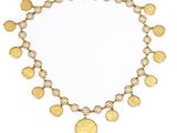 a gold coin necklace on a white background