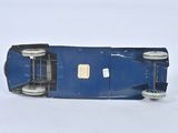 a blue toy car that is sitting on a white surface