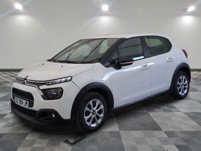 the white citrole is parked on a checkered floor