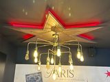 a chandelier hanging from the ceiling of a restaurant