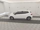 a white car parked in a garage with a checkered floor