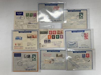 six envelopes with stamps on them sitting on top of a table