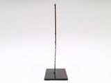 an image of a sculpture of a stick with writing on it