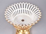 an image of a white and gold bowl on a gold stand