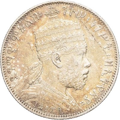 a close up of a coin on a white background
