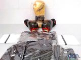 a pair of boxing gloves sitting on top of a plastic bag