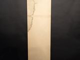 a tall piece of wood with a crack in the middle of it