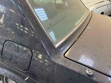 an image of a dirty car in a garage