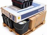 a stack of boxes and containers sitting on top of a pallet