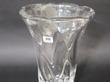 a glass vase that is sitting on a table
