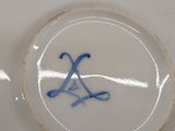 a white plate with a blue and white design on it