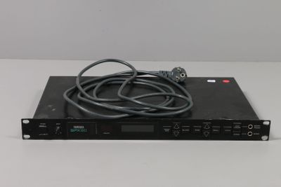 a close up of a black electronic device on a white surface