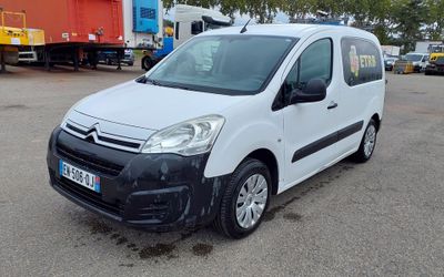 the white van is parked in a parking lot with other vehicles