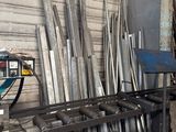 several pieces of metal are stacked on a table in a workshop