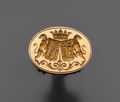 un gros plan d'une pièce d'or sur laquelle figurent deux lions