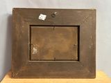 a picture of an old picture frame on a table