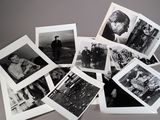 many black and white photographs of people on a table