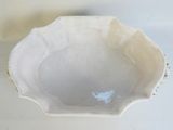 a white bowl that has a blue bird on it