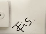 a close up of a white toilet with the word yes written on it