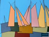 brightly colored sailboats against a bright blue sky on a sunny day