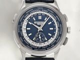 a close up of a wrist watch with a blue dial