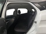 a white car with its door open and a black seat