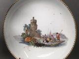 an image of a plate with a painting of a castle on it