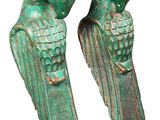 pair of green bird figurines sitting on top of each other