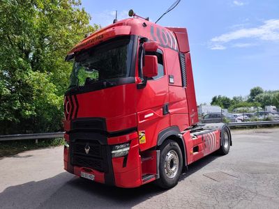 a red truck that is parked on the side of the road