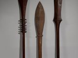 two wooden spoons and a fork are sitting on a table