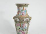 a vase that is sitting on a white surface