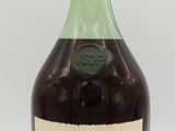 an image of a bottle of grand marnier next to a glass of wine