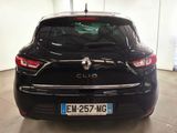 the back of a black car parked in a garage