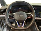 the interior of a car with a steering wheel and dashboard controls