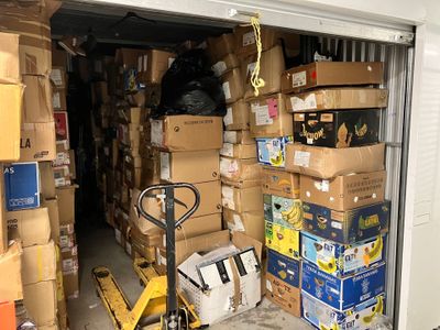many boxes stacked on top of each other in a garage