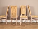 three chairs are lined up against a wall in a room