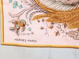 a scarf with a picture of a cat and a bird on it