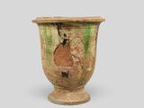 an old vase that is sitting on a table
