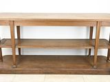 a wooden table with two shelves on top of it