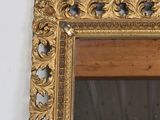 a mirror hanging on the wall in a room