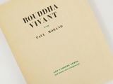 a close up of a book on a white surface