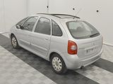 a silver car that is parked in a garage